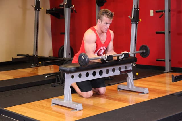 Palms-Up Barbell Wrist Curl Over A Bench - view 2