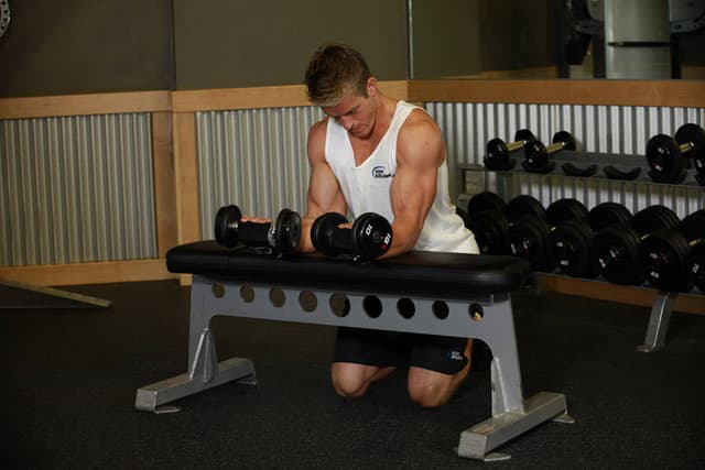 Palms-Up Dumbbell Wrist Curl Over A Bench - view 2