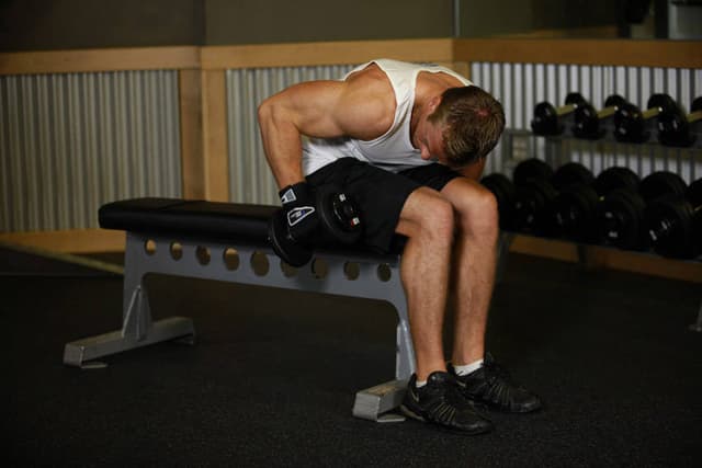 Seated Bent-Over One-Arm Dumbbell Triceps Extension