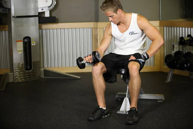 Seated One-Arm Dumbbell Palms-Down Wrist Curl - view 2