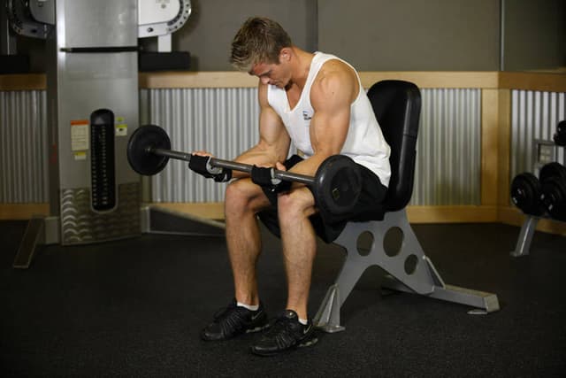 Seated Palm-Up Barbell Wrist Curl - view 2