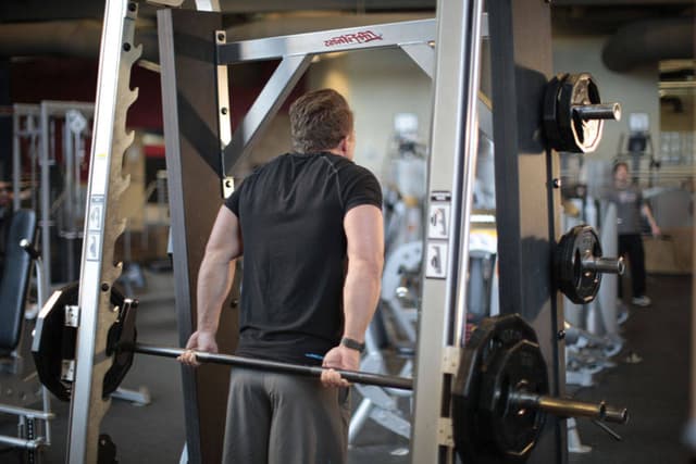 Smith Machine Behind the Back Shrug - view 2