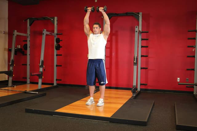 Standing Dumbbell Straight-Arm Front Delt Raise Above Head - view 2