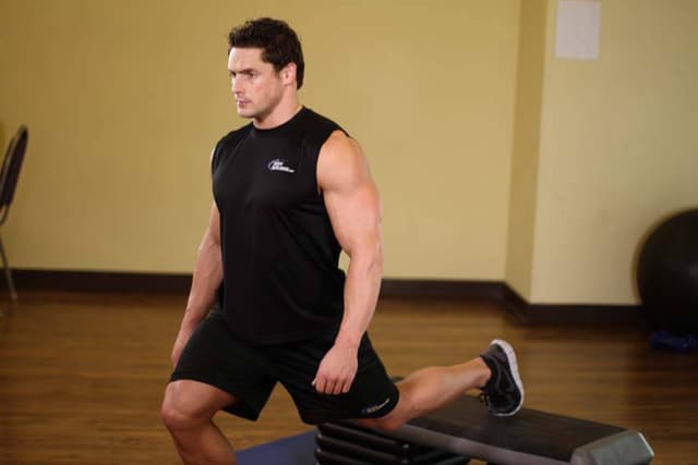 Standing Elevated Quad Stretch - view 2