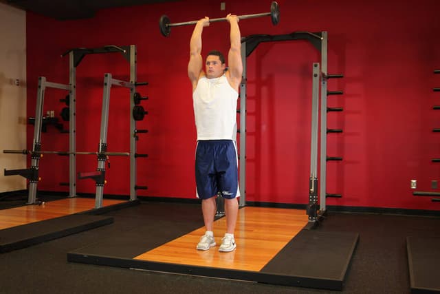 Standing Overhead Barbell Triceps Extension - view 2